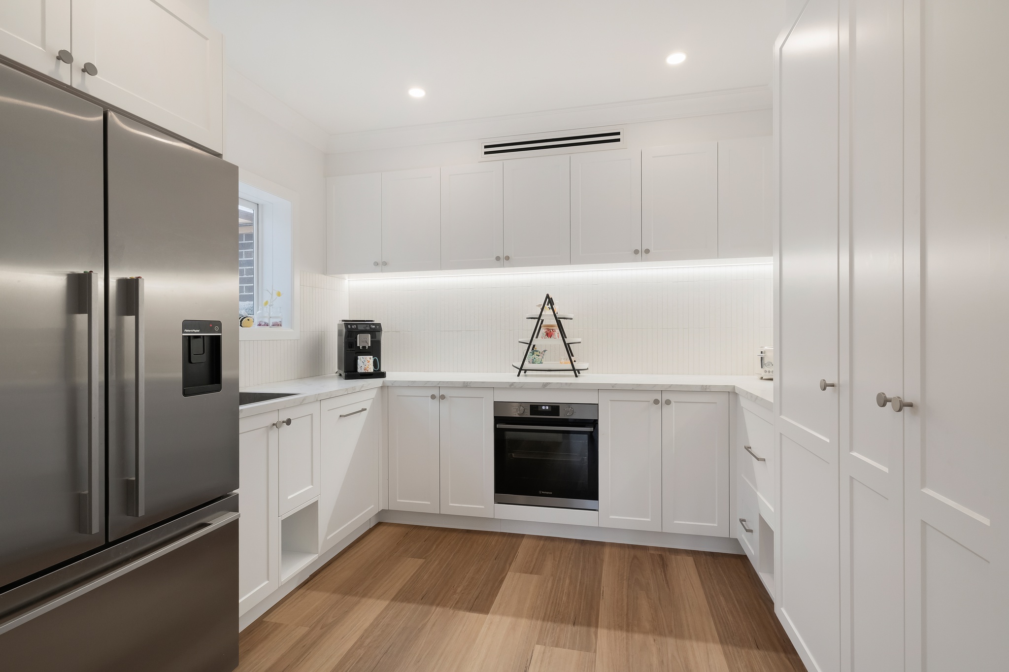 Walk-in butler's pantry with second oven and coffee station